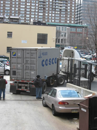 Fully loaded shipping container leaving the Academy of  Natural Sciences